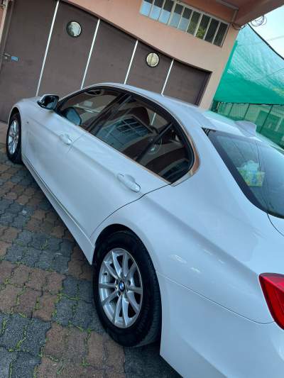 A BMW 320i automatic transmission sedan car - Luxury Cars on Aster Vender