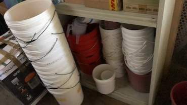 Plastic buckets on Aster Vender