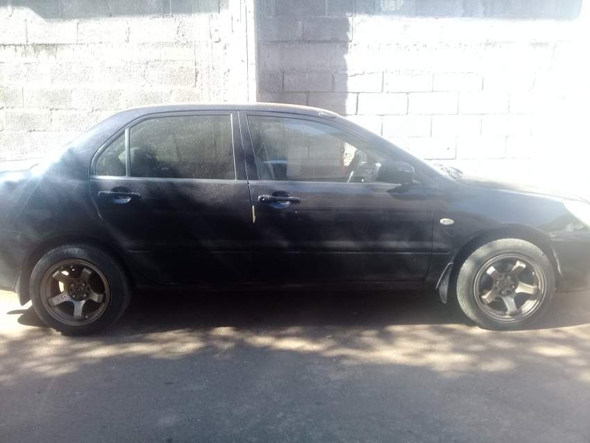 MITSUBISHI LANCER GLX  - 1 - Family Cars  on Aster Vender