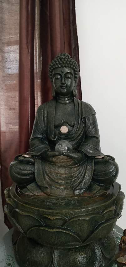 buddha statue with pump on Aster Vender