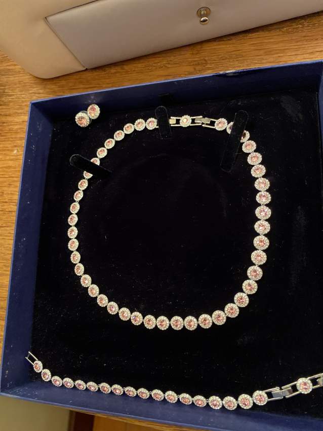 Necklace, with matching bracelet and earrings on Aster Vender