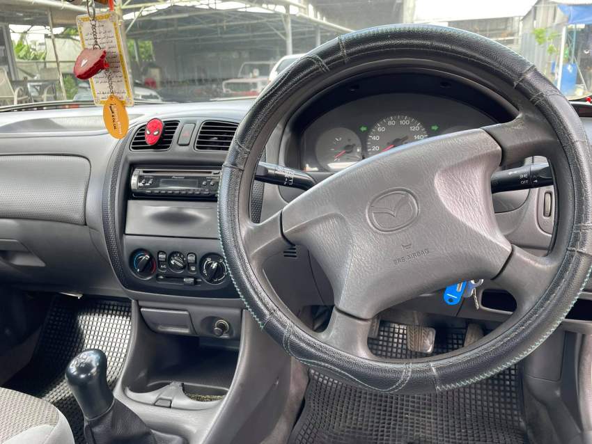 Mazda Familia Year 99  - 5 - Family Cars  on Aster Vender