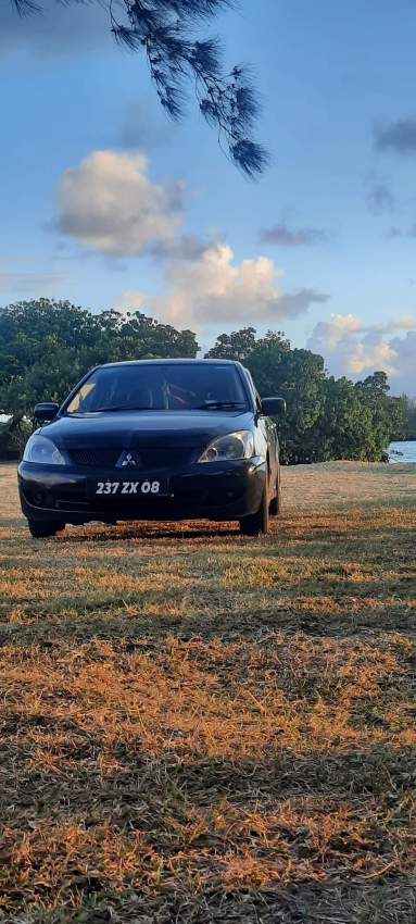 A Vendre Mitsubishi Lancer  tou bon ladan nek prnd roule - 1 - Sport Cars  on Aster Vender