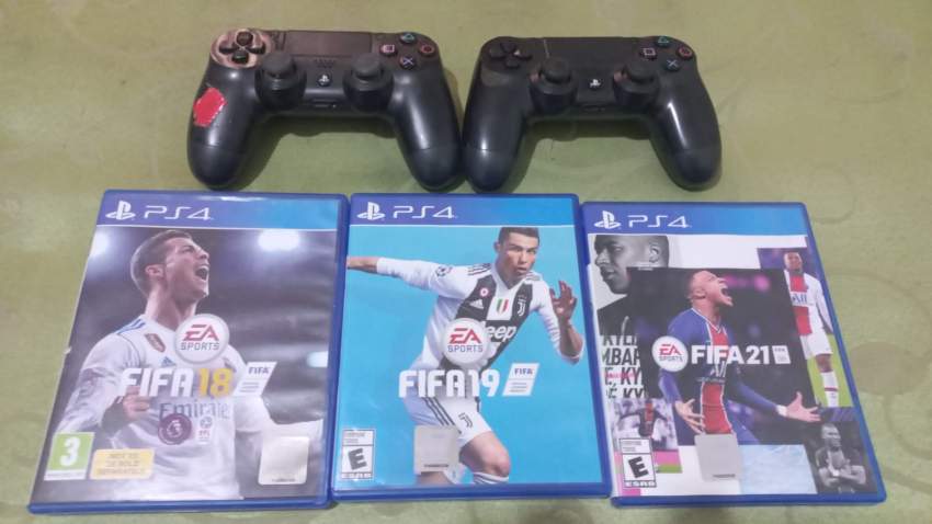 PLAYSTATION 4 Slim - 1TB with Wireless Controllers & FIFA 18, 19, 21 - 2 - All electronics products  on Aster Vender