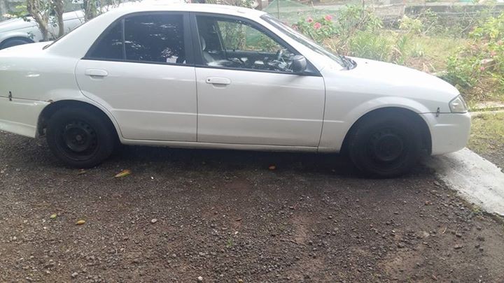 MAZDA 323 SEDAN 1999 - 4 - Family Cars  on Aster Vender