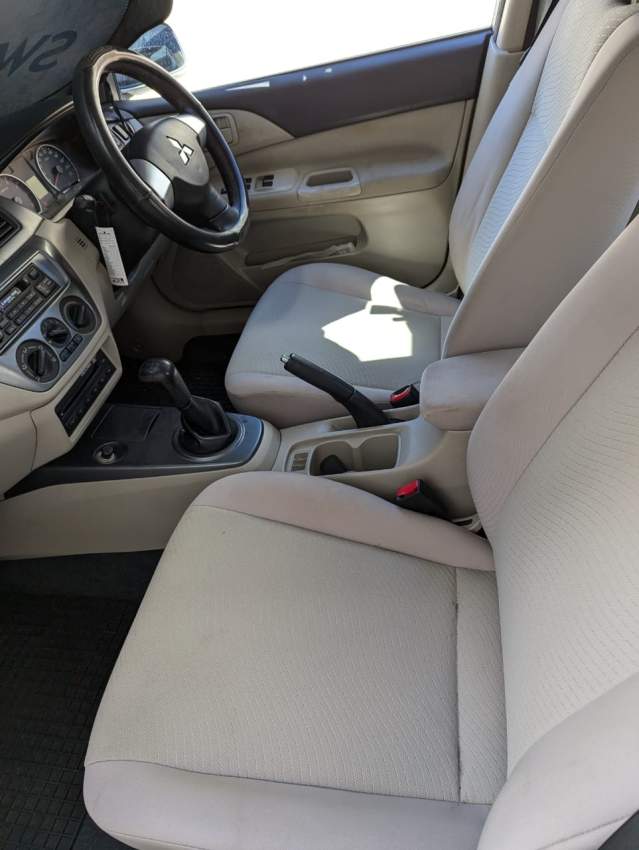 Mitsubishi Lancer GLX Saloon Colour White - 4 - Family Cars  on Aster Vender