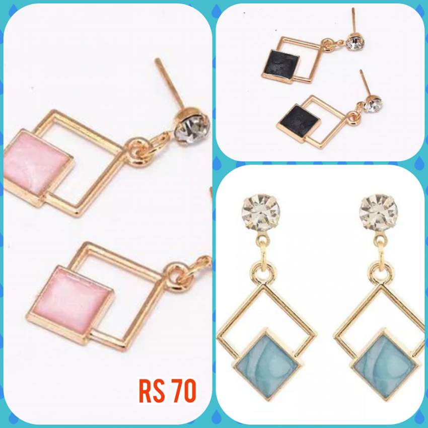 Blue, black and pink earrings on Aster Vender