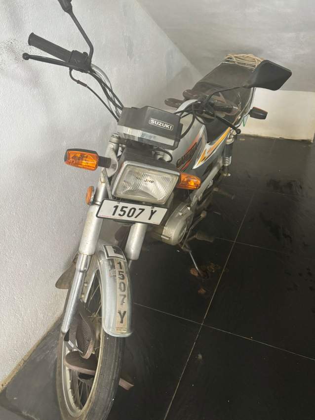 Suzuki AX 100 - 1 - Roadsters  on Aster Vender