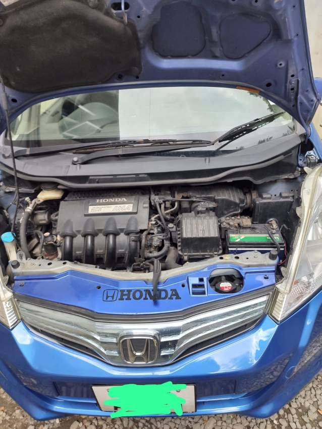 Honda Fit 2011 (Hybrid / Automatic) - 4 - Compact cars  on Aster Vender