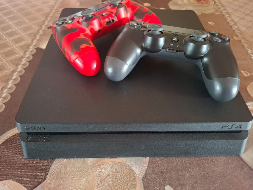 PS4 SLIM ( An additional free controller + 1 game not included in cost )