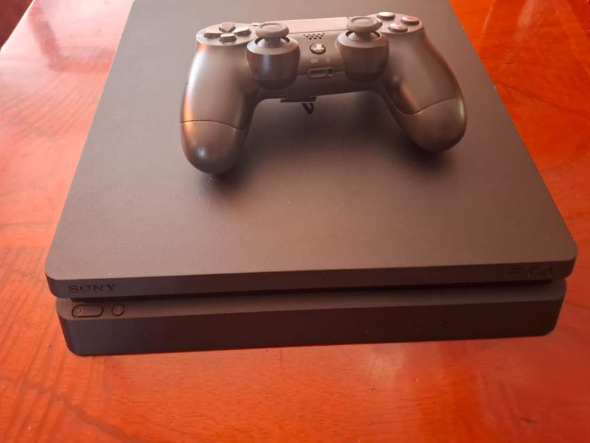 PS4 SLIM ( An additional free controller + 1 game not included in cost ) - 1 - PlayStation 4 (PS4)  on Aster Vender
